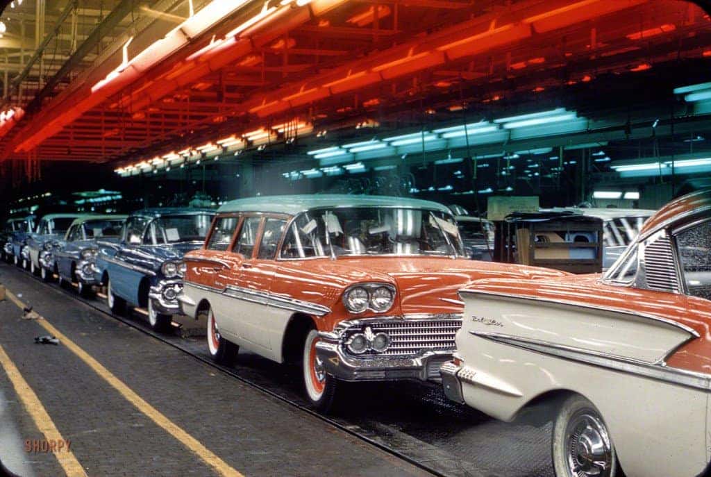 An exterior shot of three cars