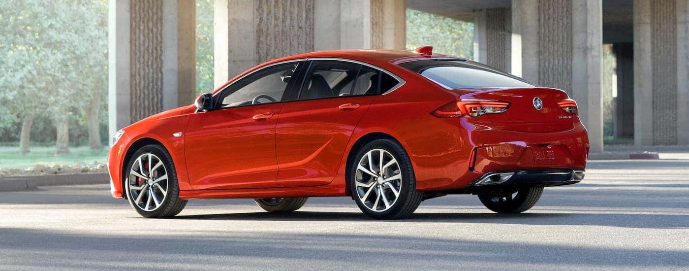 A red 2019 Buick Regal GS is in a bright parking garage.