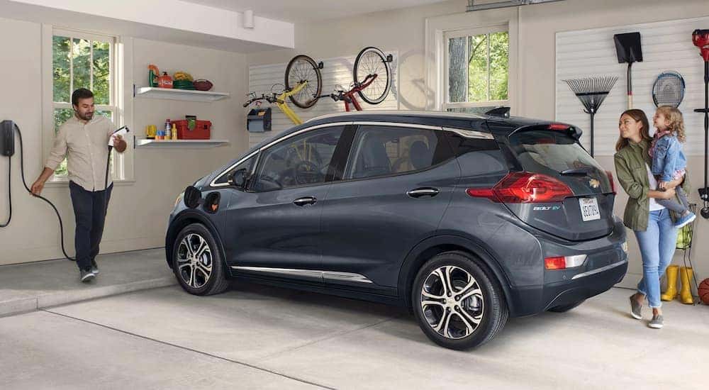 A grey 2020 Chevy Bolt is parked in a garage after returning from a used Chevy dealership near you.
