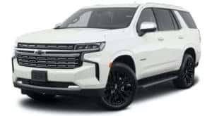 A white 2021 Chevy Tahoe Premier is angled left.