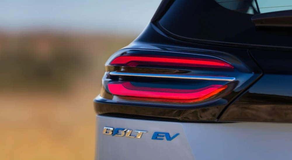 A light blue 2022 Chevy Bolt EV shows a close up of the drivers side taillight.