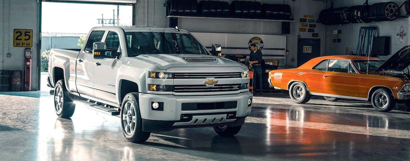 A white 2017 Chevy Silverado 2500 HD LTZ is shown parked in a garage.