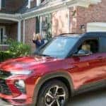A teen driver is shown leaving home driving a red 2021 Chevy Trailblazer.