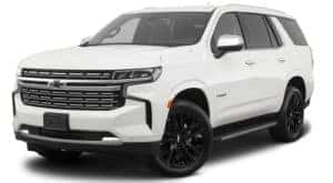 A white 2022 Chevy Tahoe Premier is facing left.