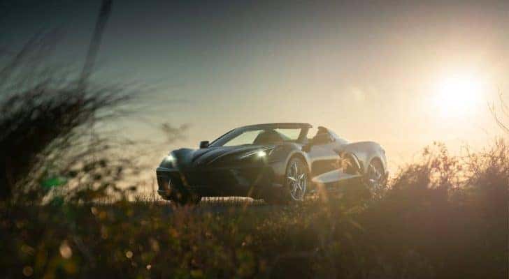 A bronze 2020 Chevy Corvette is shown on a sunny day.