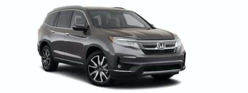 A grey 2022 Honda Pilot Elite is angled right.