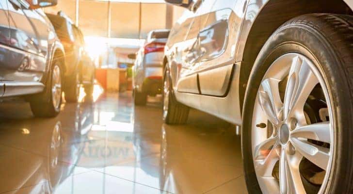 A Louisville used car dealer shows the gallery from a low angle.