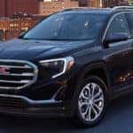 2020 GMC Terrain with city behind