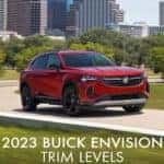 2023 Buick Envision Driving with City Backdrop