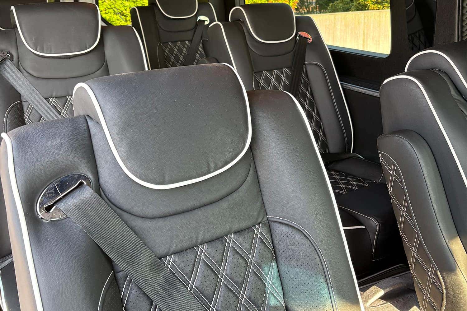 National Traveler luxury Sprinter van interior with captain's chairs