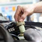 Technician performing a brake fluid exchange