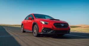 red subaru wrx driving