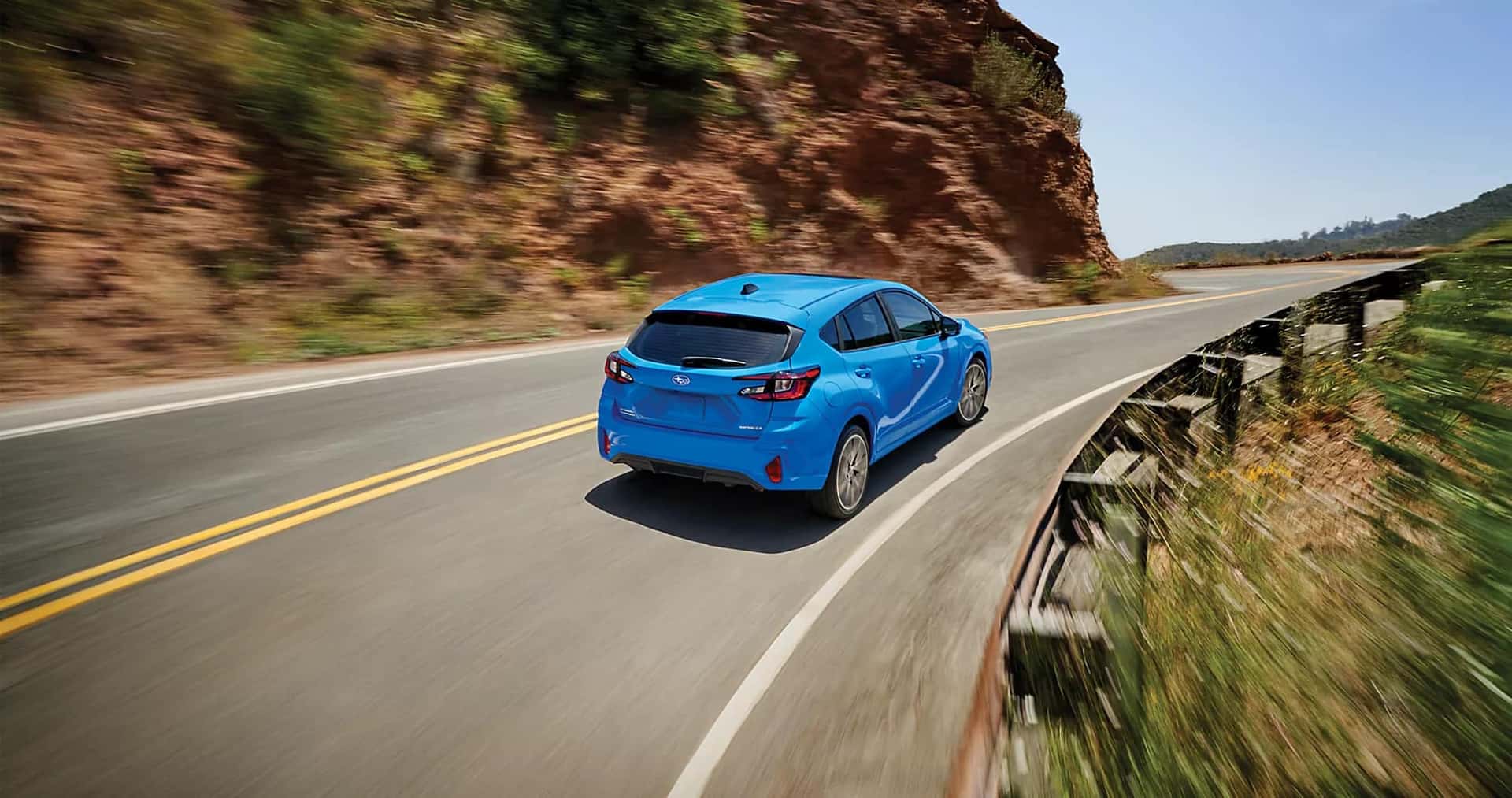 2025 Subaru Impreza taking a curve