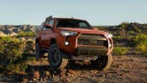 orange 4runner offroading