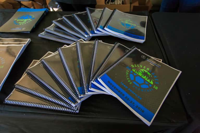 Booklets fanned out in a stack on a table