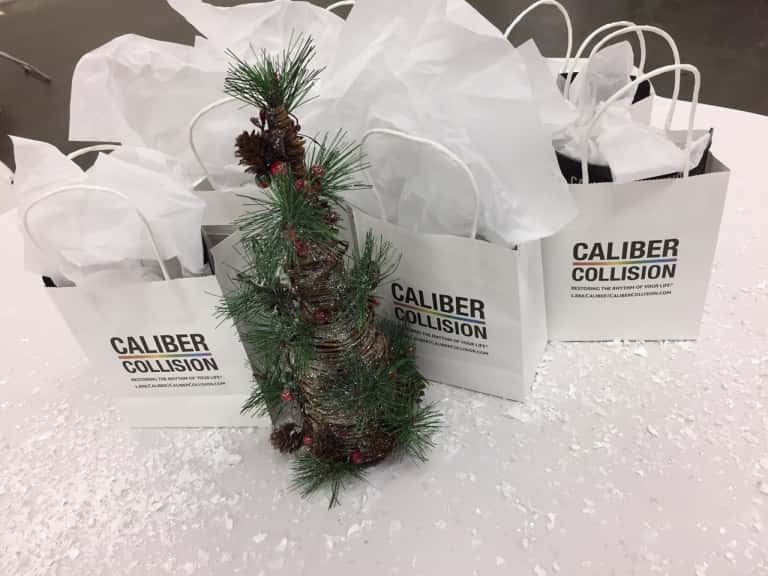 Caliber Collision Gifts to Fletcher Jones Team