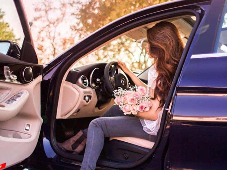 Woman getting into Car