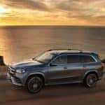 gls driving on road at sunset