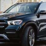2020 GLE SUV pulling onto street near building renovation site