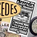 Depictions of numerous iterations of Mercedes-Benz logo and advertisements alongside one of the original Mercedes-Benz cars