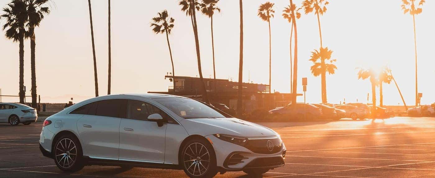 white mercedes on beach