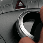 Close-up of hand using the COMAND controller