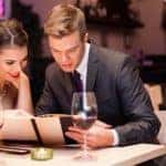 Young couple enjoying a romantic dinner with wine
