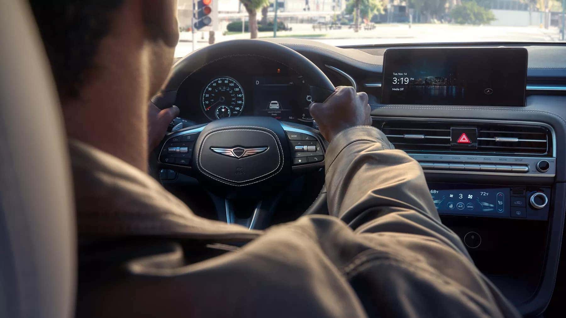 Person behind the wheel of the 2026 Genesis G70