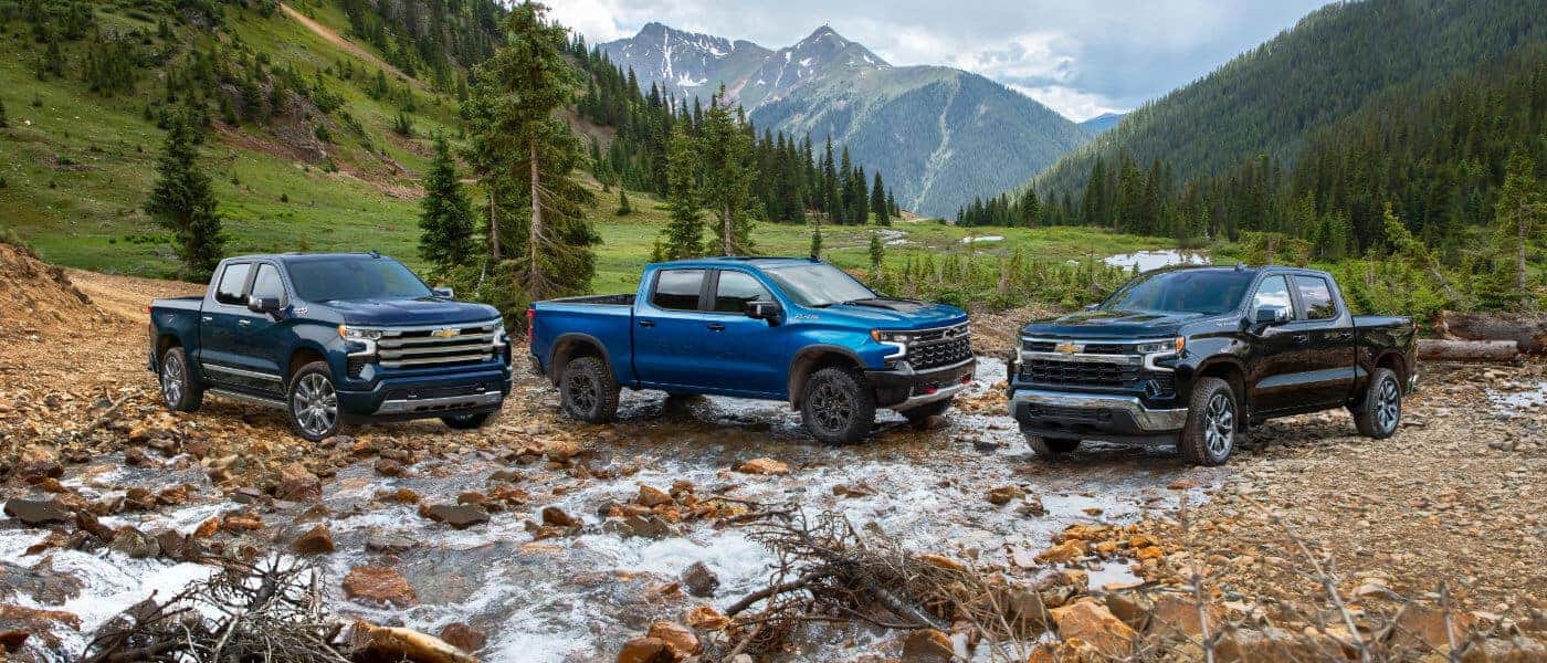 Three 2024 Chevy Silverado 1500's in mountain valley
