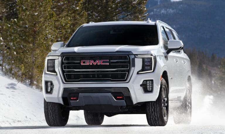 2023 GMC Yukon exterior head on in snow