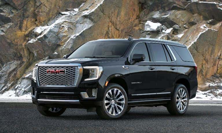 2023 GMC Yukon exterior parked in front of mountains