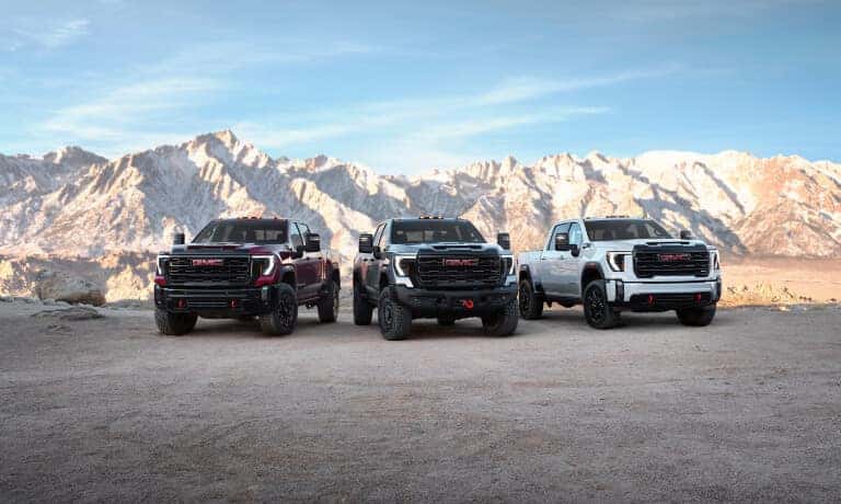 2024 GMC Sierra 2500 HD lineup in front of mountains