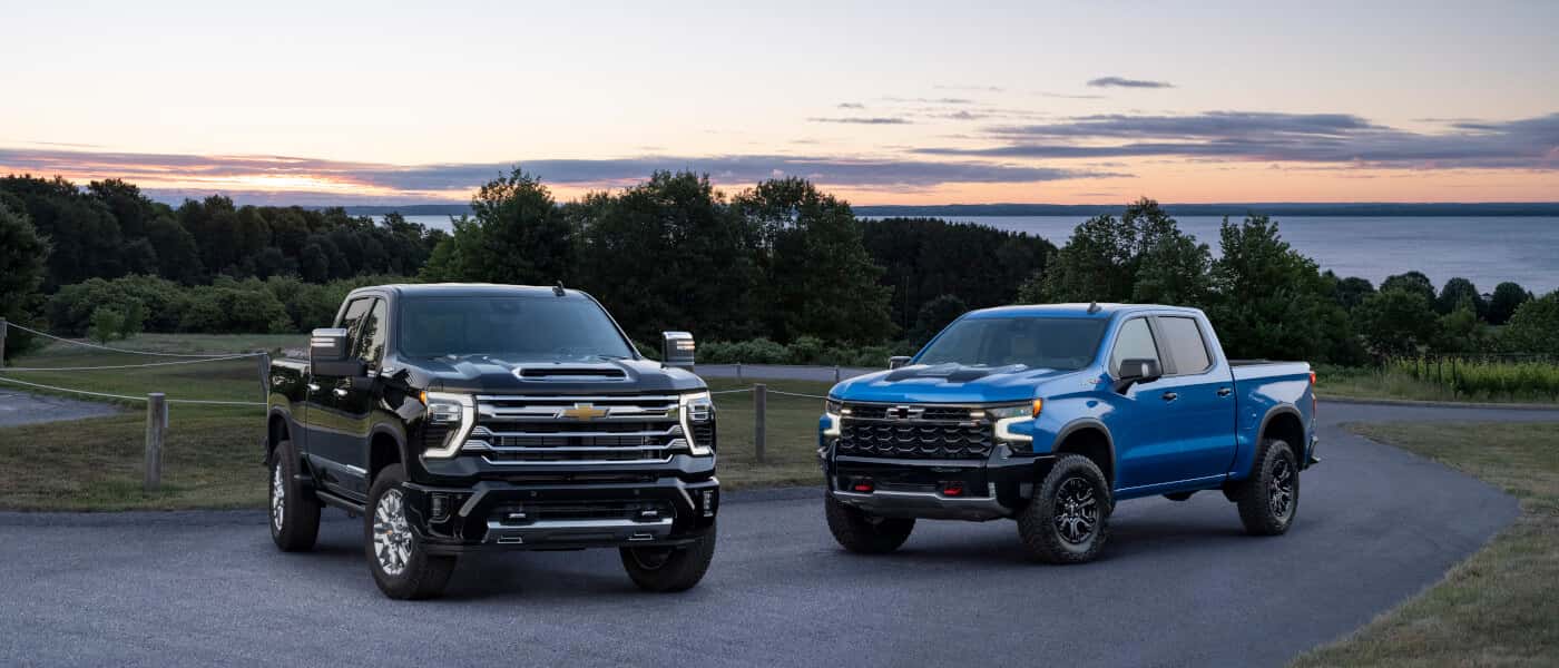 2026 Chevy Silverado 2500 HD pair parked overlooking lake
