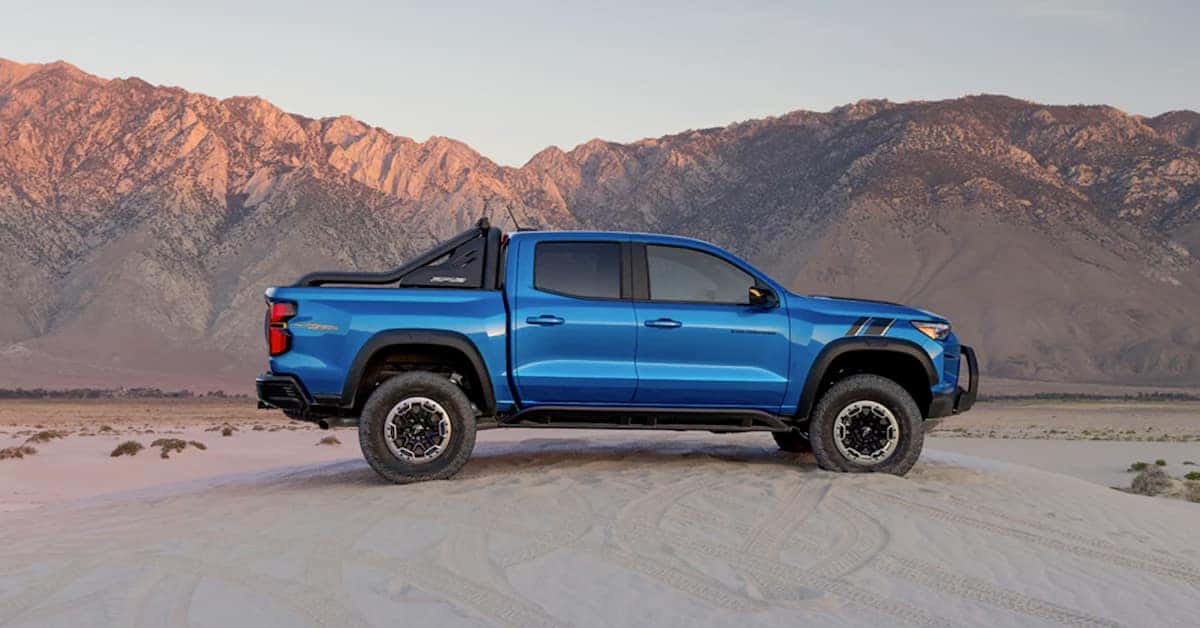 2023 Chevrolet Colorado - In front of mountains on sand