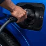 A man charging a Chevy EV