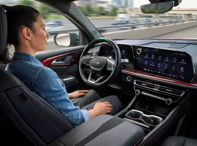 Driver using hands-free controls in a Chevrolet