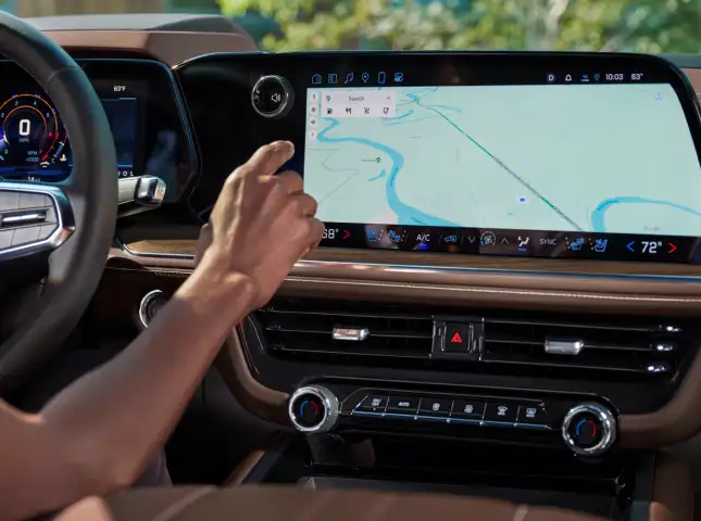 Driver using native apps on Chevrolet infotainment display