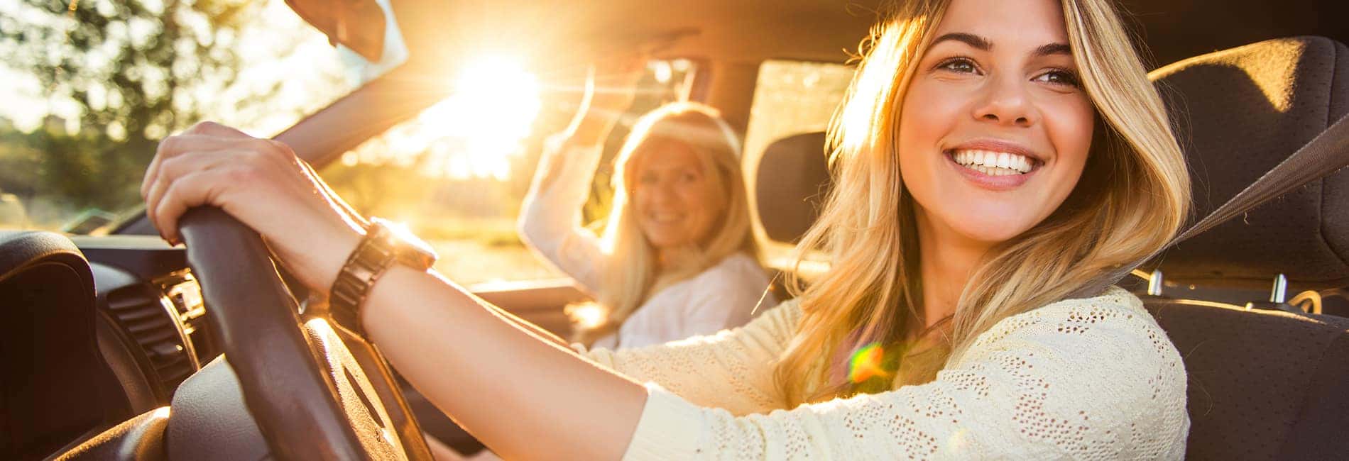 Daughter in her first car with her mother