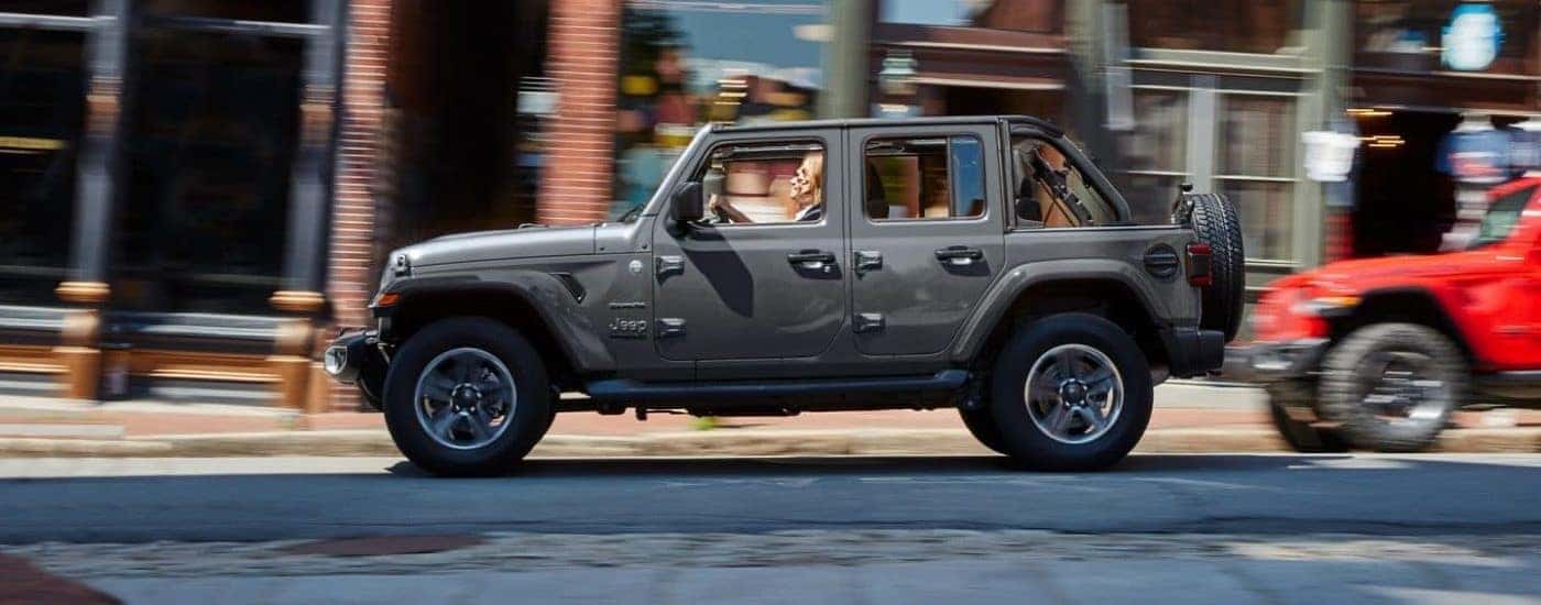 Grey 2021 Jeep Wrangler Sahara Unlimited going to vie used SUVs for sale