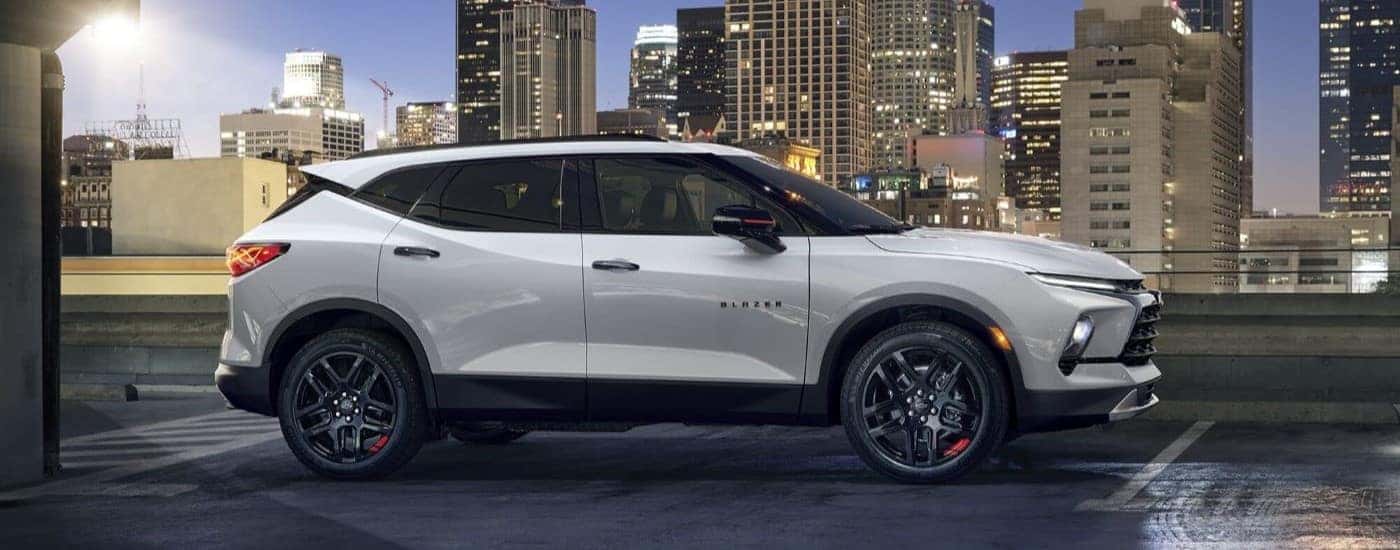 A white 2024 Chevy Blazer parked near a city.