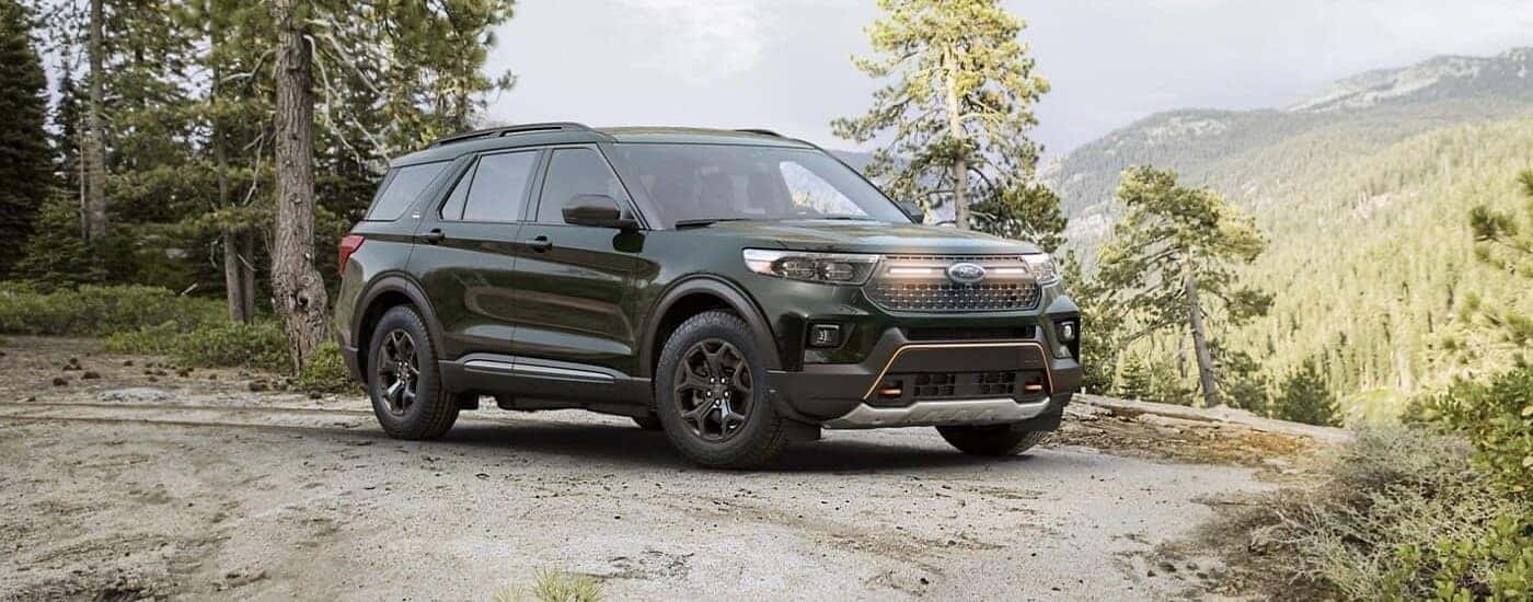 A black 2023 Ford Explorer Timberline parked off-road on a trail