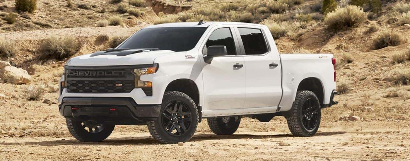 A white 2025 Chevy Silverado 1500 Trail Boss parked.