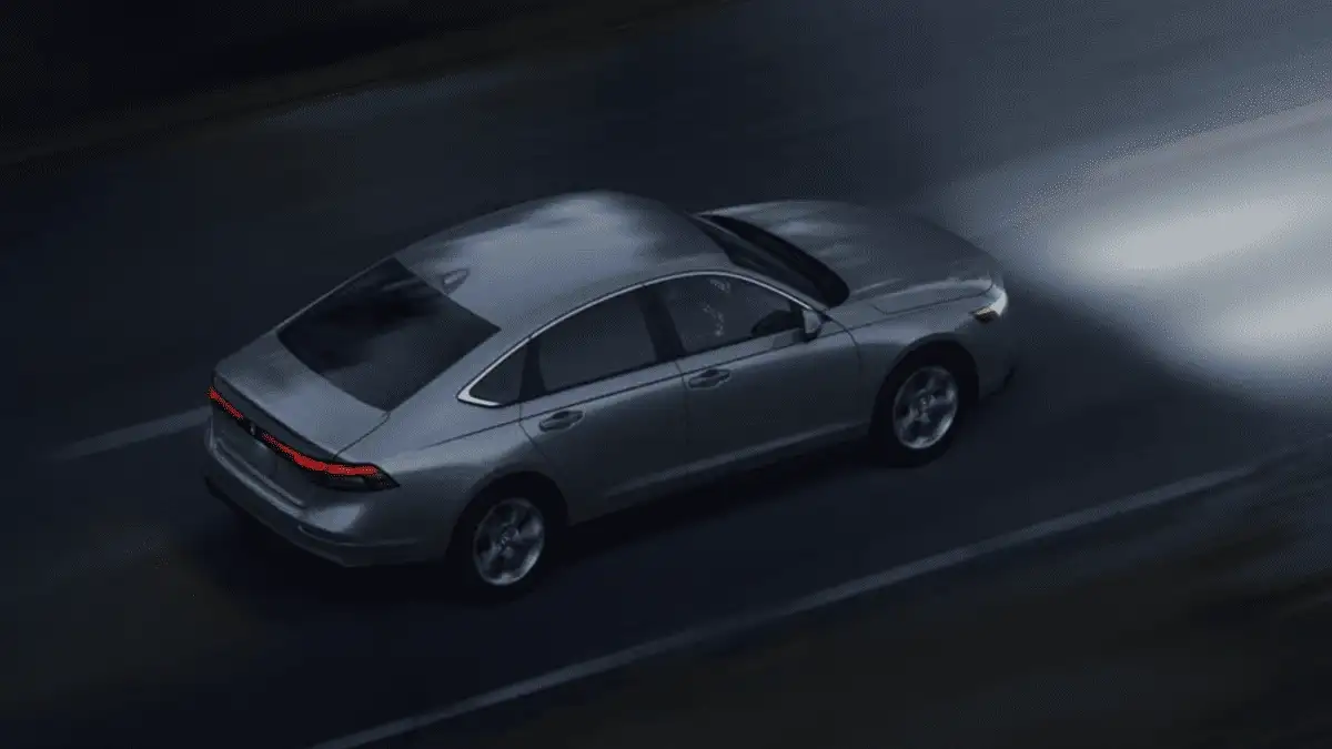 2026 Honda Accord near Smithtown, NY, overhead view of the sedan driving on a highway with motion blur and LED taillights