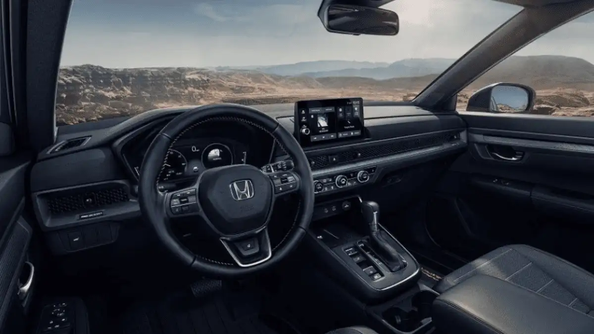 2026 Honda CR-V near Smithtown, NY, blue SUV driving on a forest dirt road with dust trail and sunlit trees