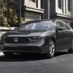 Updated 2026 Honda Accord near Smithtown NY on a quiet city street, front three quarter view for confident winter commuting