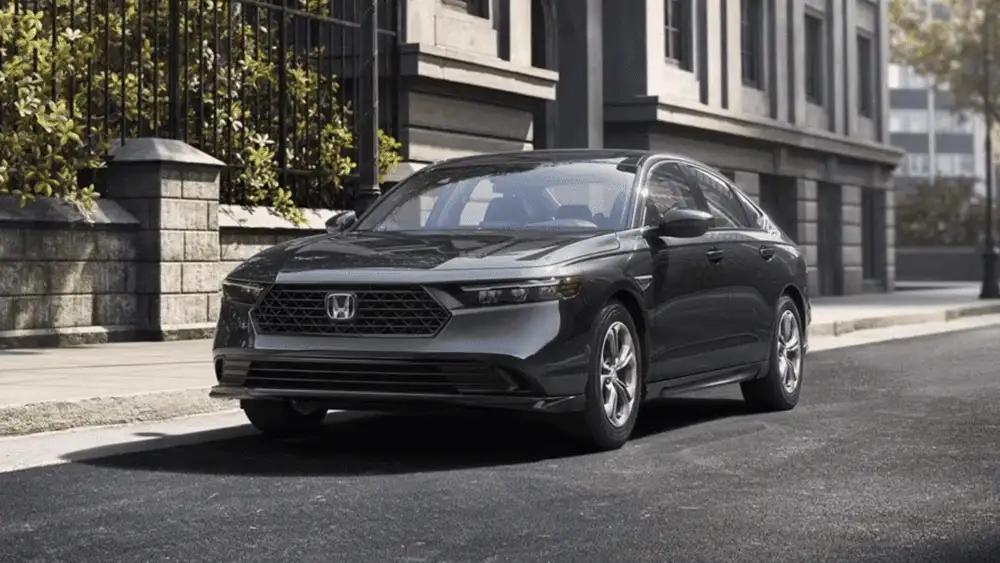 Updated 2026 Honda Accord near Smithtown NY on a quiet city street, front three quarter view for confident winter commuting