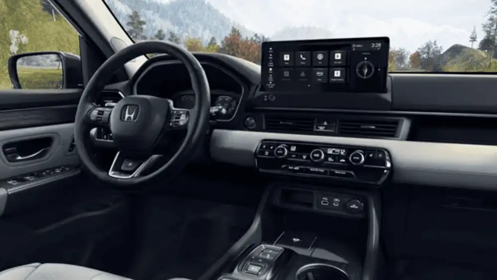 2025 Honda Pilot near Smithtown, NY interior cockpit showing steering wheel, touchscreen display, and center controls.