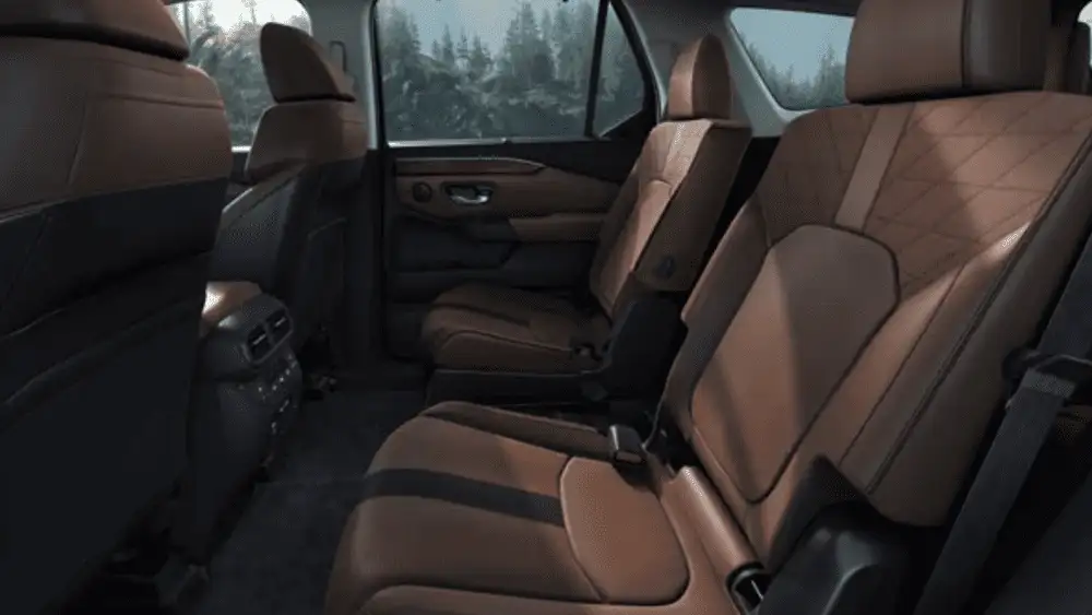 2025 Honda Pilot near Smithtown, NY second-row seating with brown leather seats and roomy passenger space.