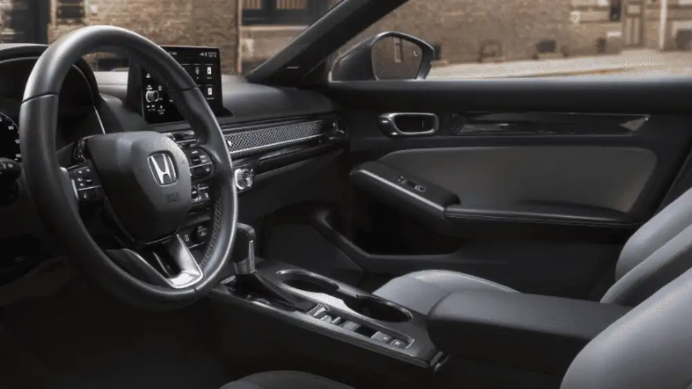 2026 Honda Civic Hatchback near Smithtown, NY interior view with dashboard, infotainment screen, and center console.