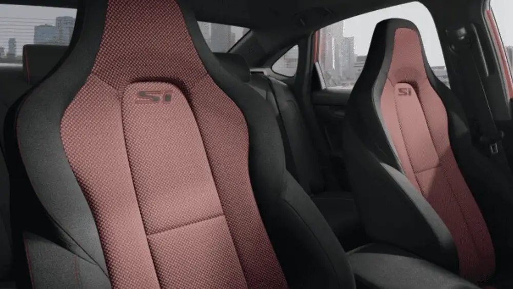 2026 Honda Civic Si near Smithtown, NY front sport seats with Si branding and performance-style bolstering.